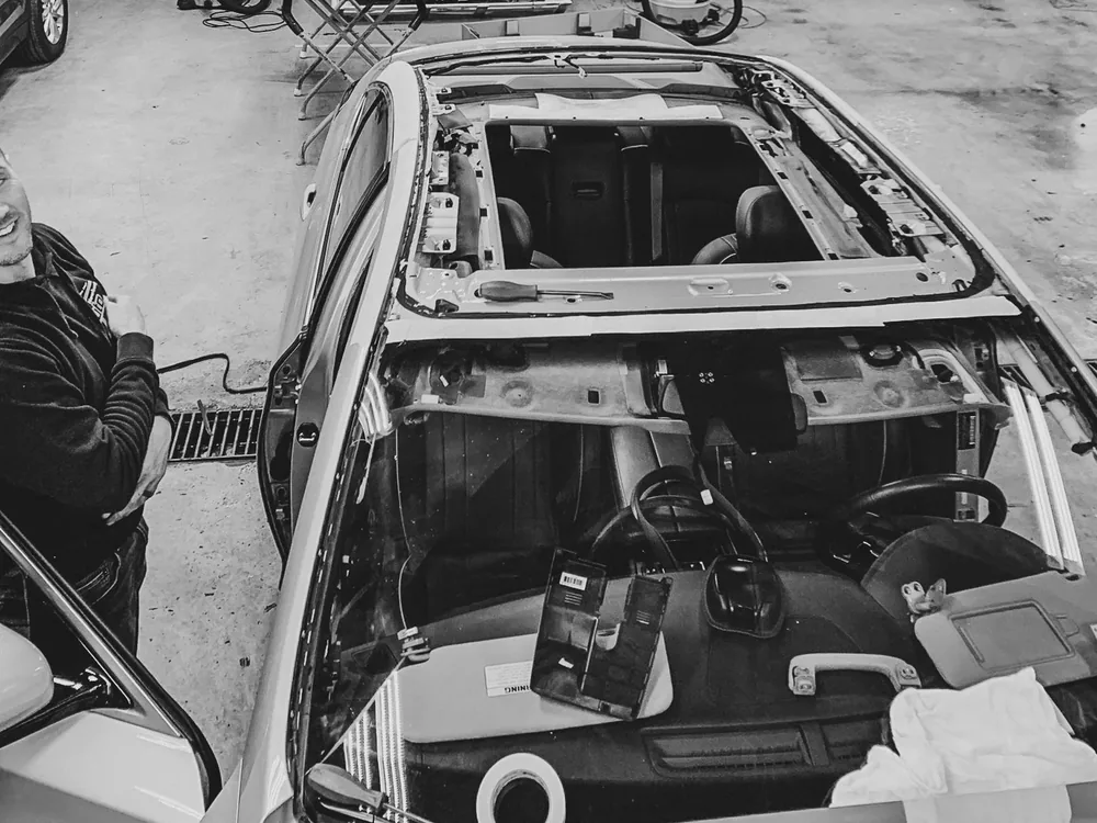 Vintage shot of a vehicle headliner removed for glass work at Newburgh Auto Glass