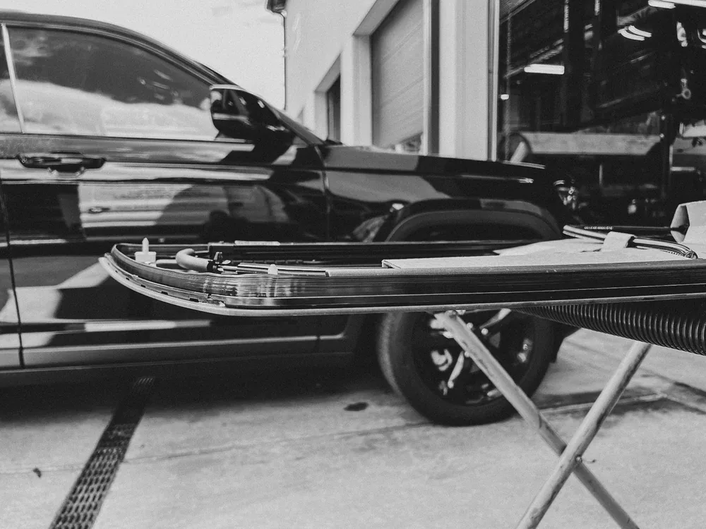 Windshield replacement underway on a sedan at Newburgh Auto Glass