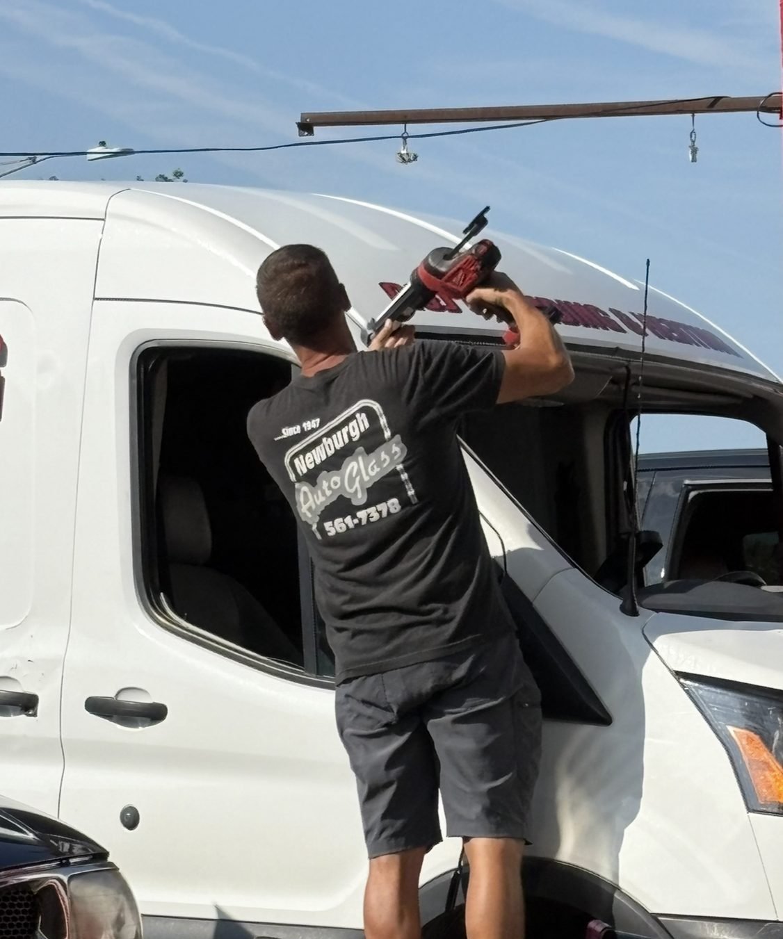 Newburgh Auto Glass technician replacing a Ford Transit van windshield