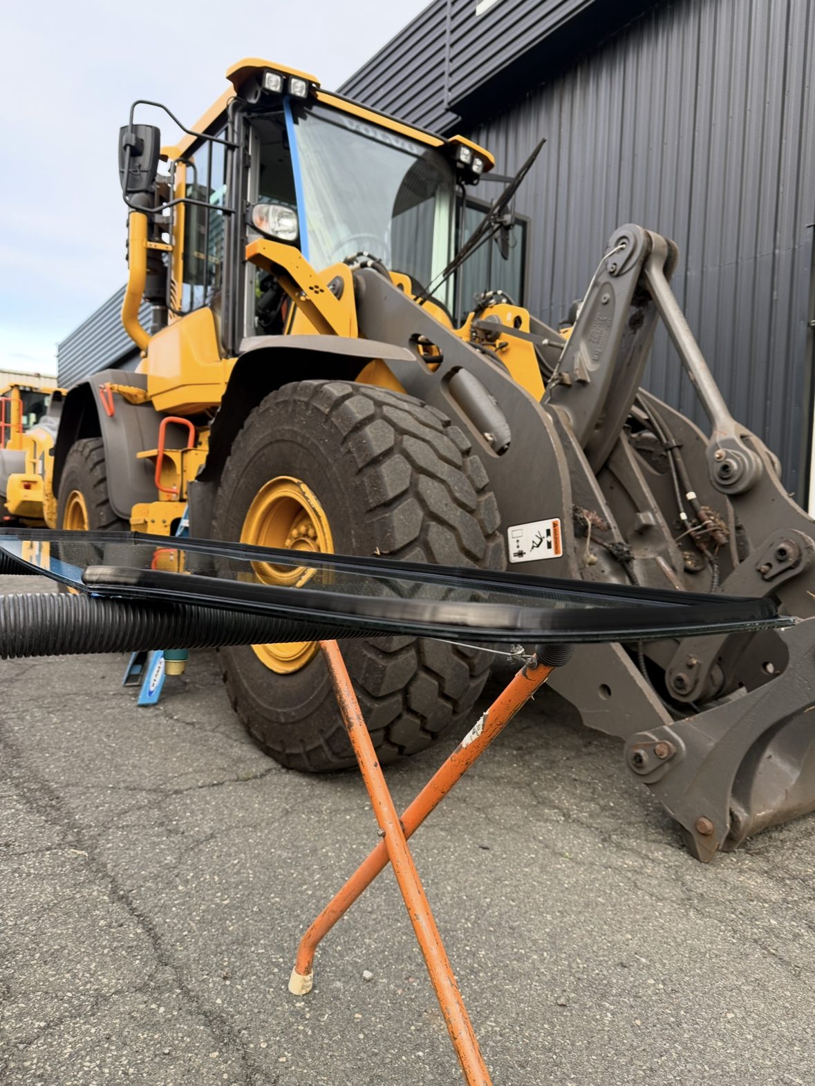 Newburgh Auto Glass servicing heavy equipment glass on a wheel loader