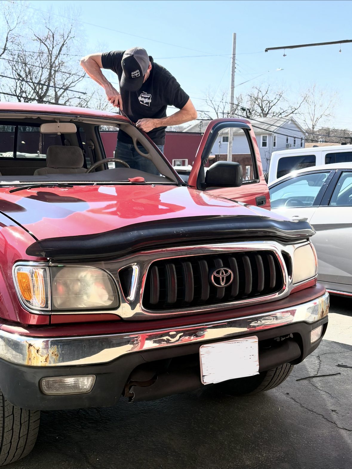 Newburgh Auto Glass technician replacing a Toyota Tacoma windshield
